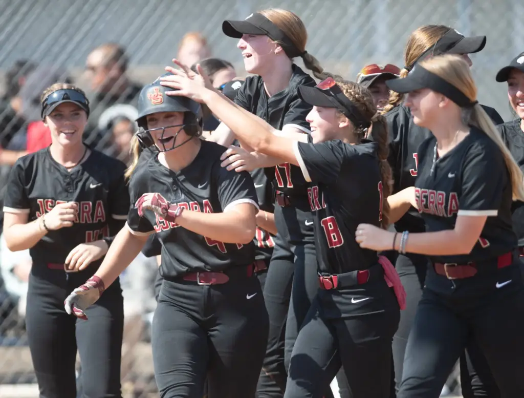 JSerraâs Annabel Raftery (#44) is surrounded by teammates at home...