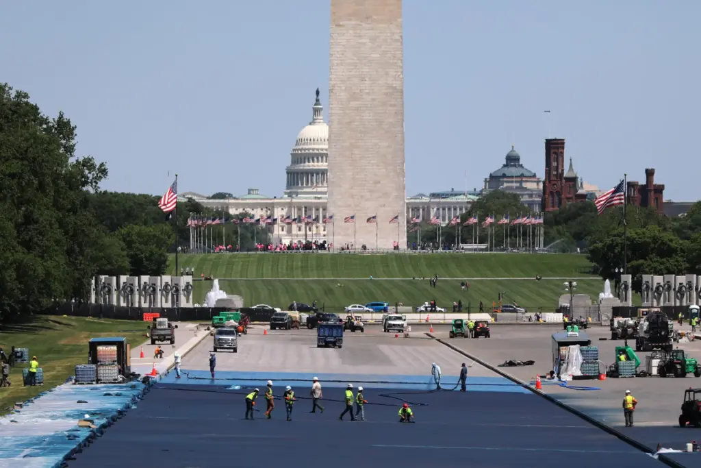 Workers apply a blue protective coating to the Lincoln Memorial Reflecting Pool.