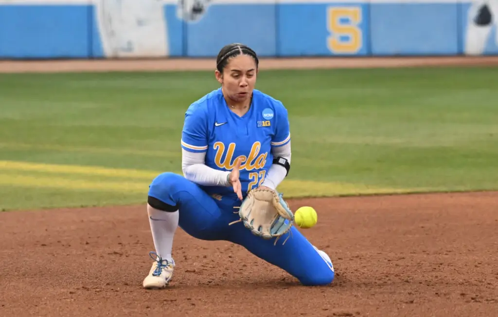 Third baseman Bri Alejandre #22 of the UCLA Bruins fields...