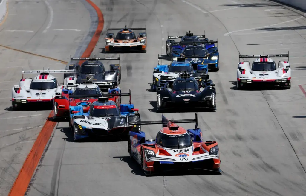 The Acura Meyer Shank Racing GTP car (93) leads the...