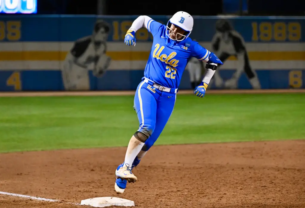 Bri Alejandre #22 of the UCLA Bruins reacts after hitting...