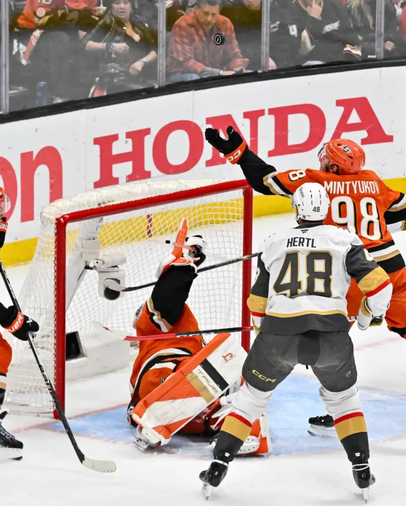 Ducks goaltender Lukas Dostal (1), Ducks defenseman Pavel Mintyukov (98)...