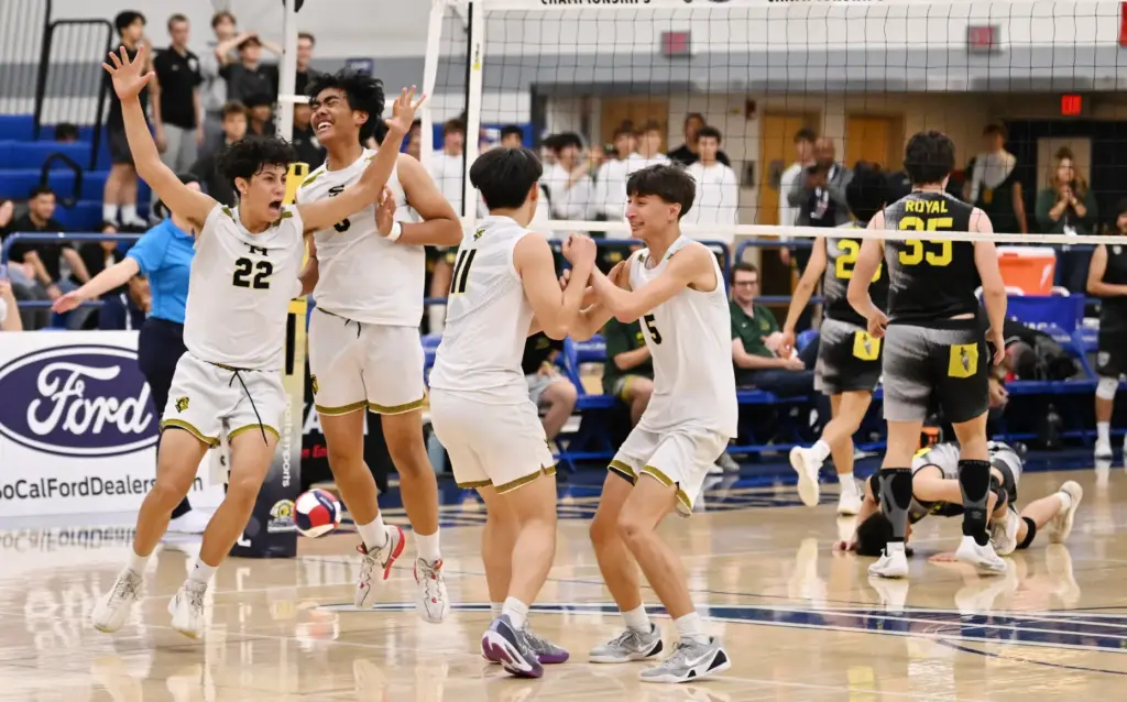 Sunny Hills Lancers celebrate after defeating the Royal Highlanders to...