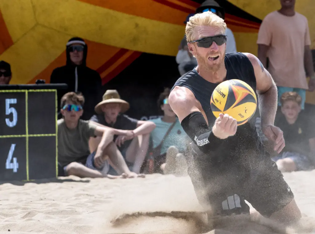 Chase Budinger kicks up the sand as he goes after...