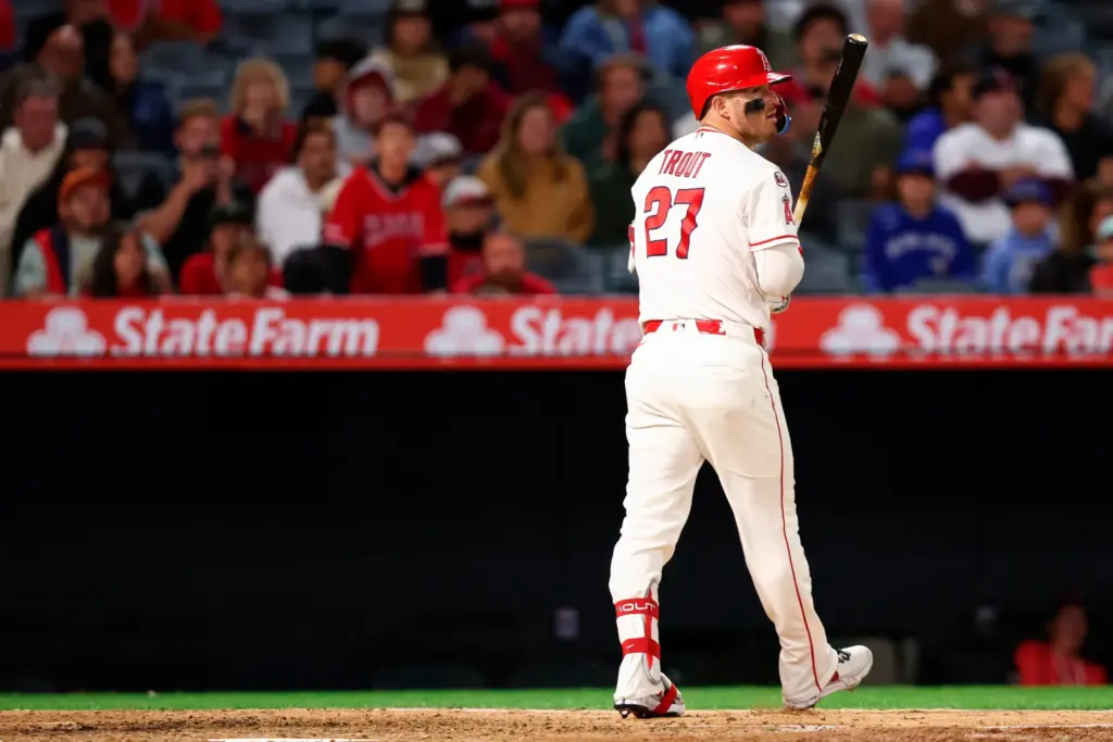 Angels star Mike Trout looks on after striking out during...