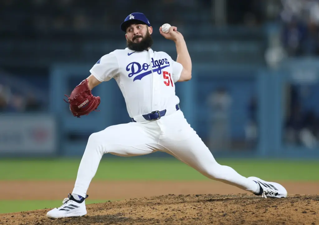 Dodgers relief pitcher Alex Vesia throws to the plate during...
