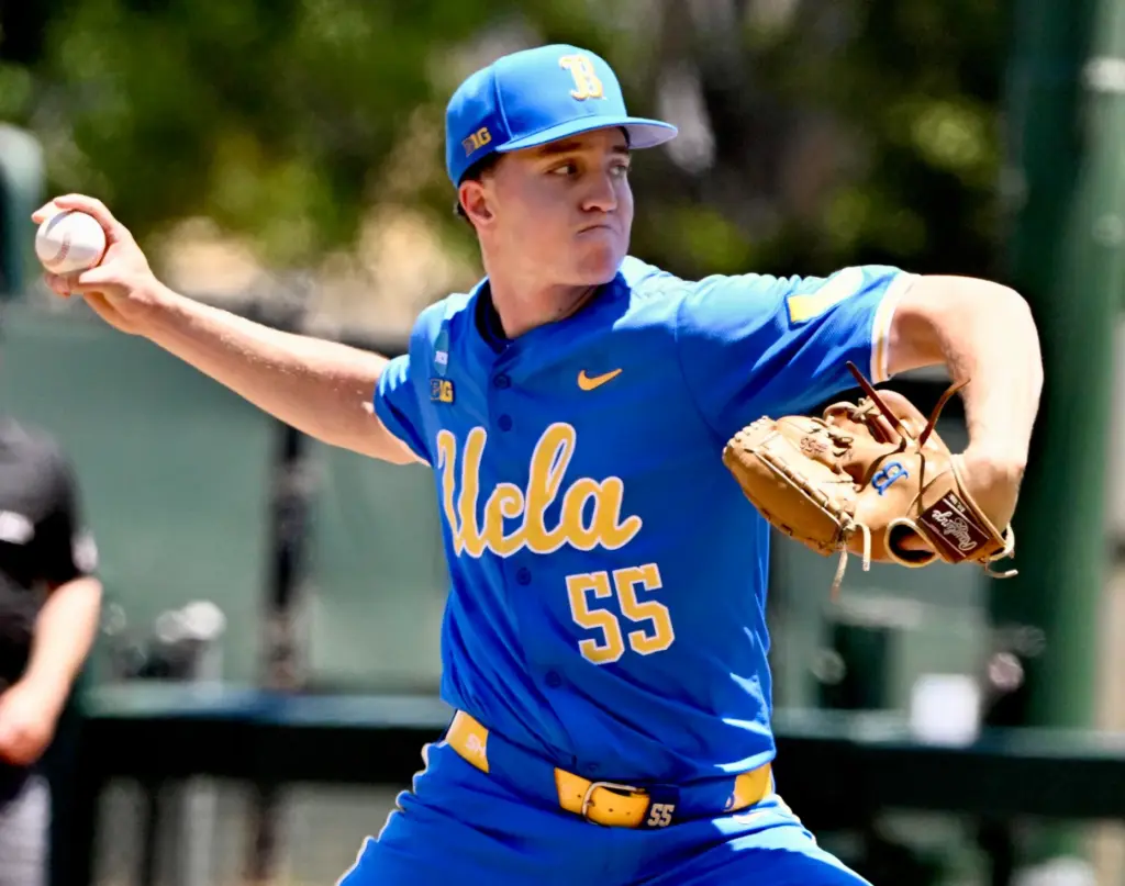 Starting pitcher Michael Barnett #55 of the UCLA Bruins throws...