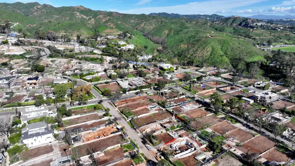 Rebuilding continues on a sunny day in Pacific Palisades on...