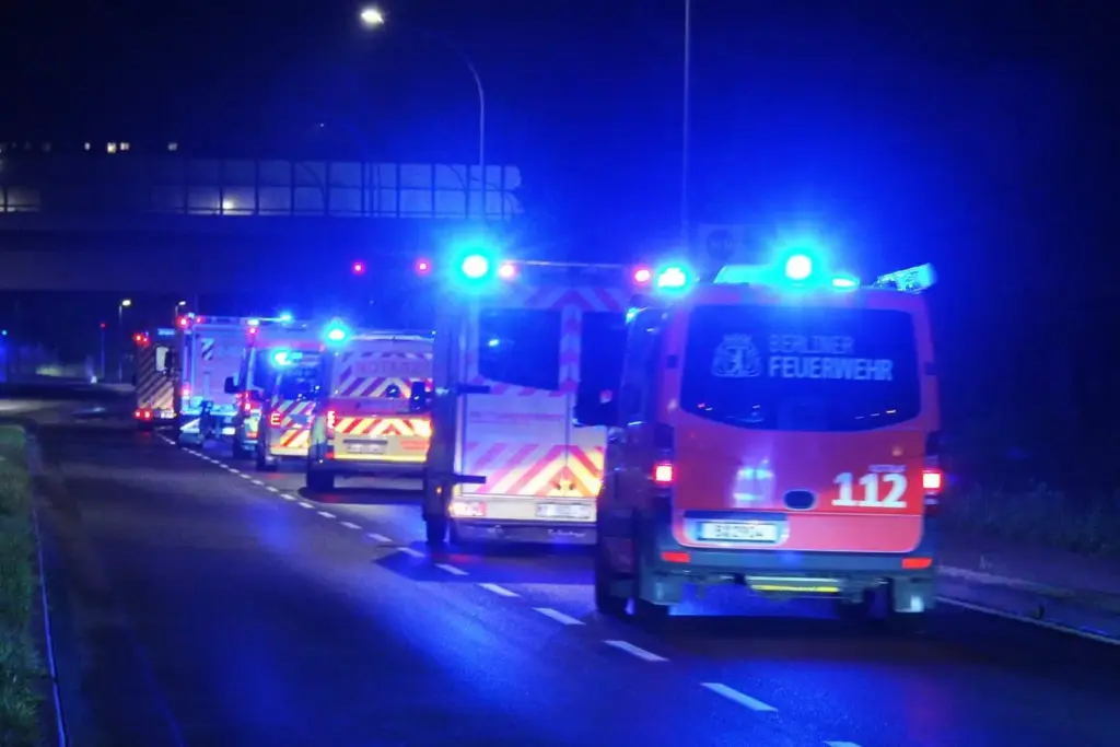 Emergency vehicles transport the family of a U.S. national who tested positive for Ebola in Congo.