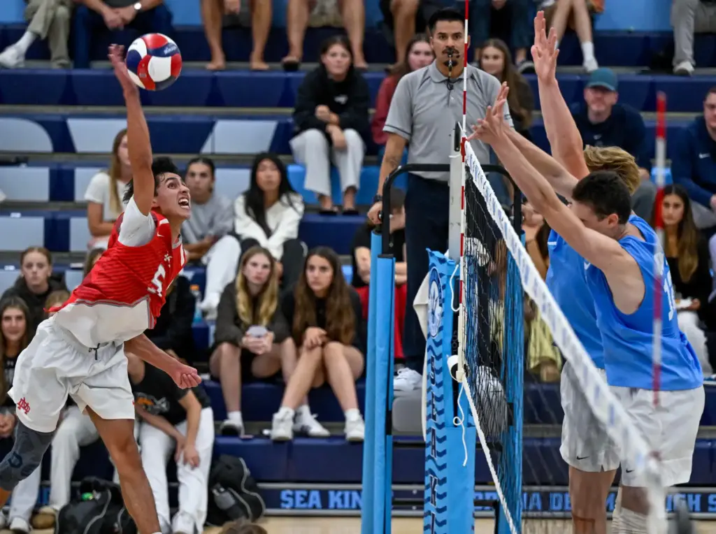 Mater Dei outside hitter Deakon Cortes hits the ball during...