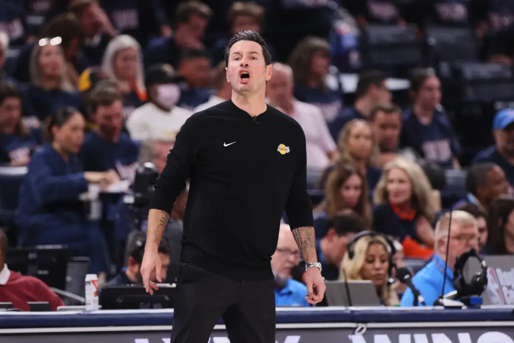 Los Angeles Lakers head coach JJ Redick reacts to play...