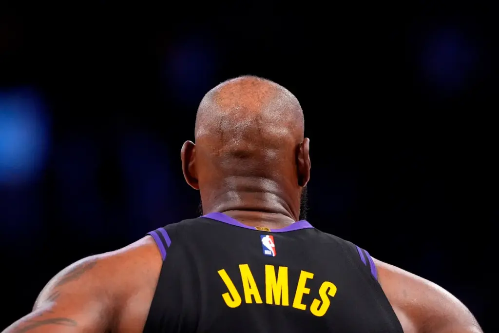Lakers star LeBron James stands on the court during the...