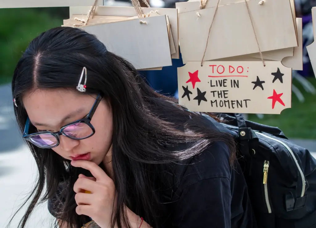 CSUF student Rebecca Paek tries to decide which affirmation to...