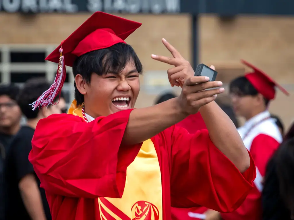 One graduate films himself during the Garden Grove High School...