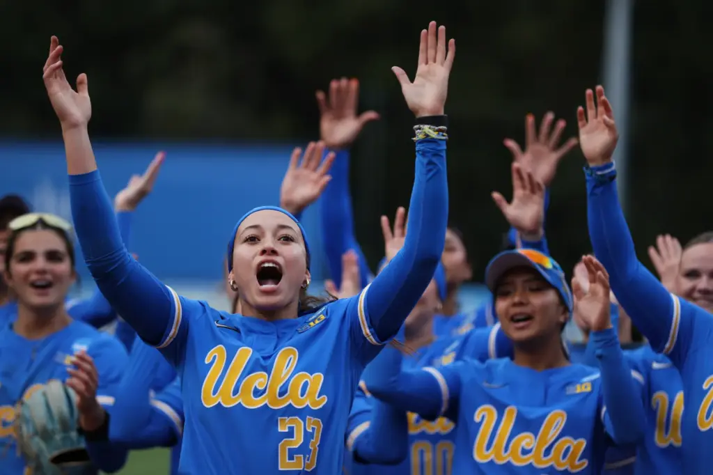 UCLAâs Taylor Tinsley (23) leads the Bruins in a cheer...