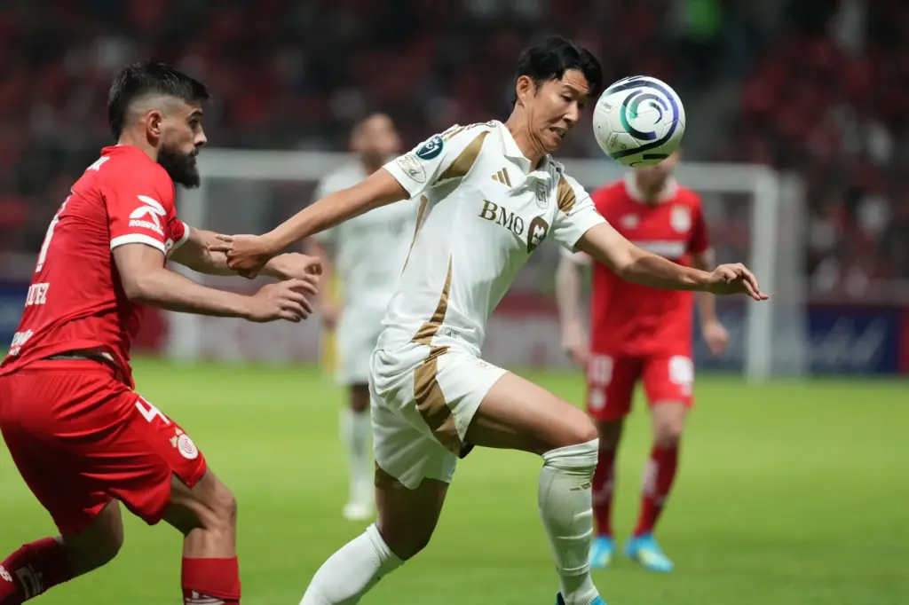 LAFC’s Son Heung-Min, right, and Toluca FC’s Bruno Mendez vie...