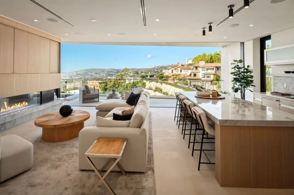 The kitchen opens to the living room. (Courtesy of The...