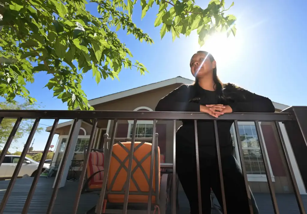 Sarai Rodarte, 29, of Apple Valley, stands on the deck...