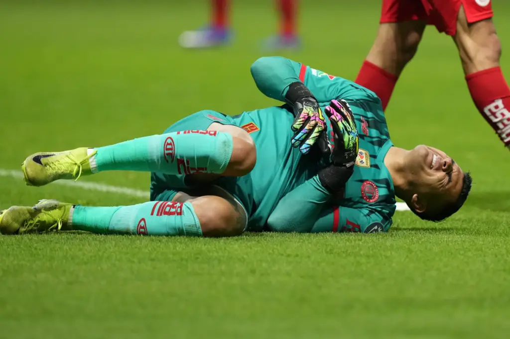 Toluca FC goalkeeper Luis Garcia grimaces in pain during the...