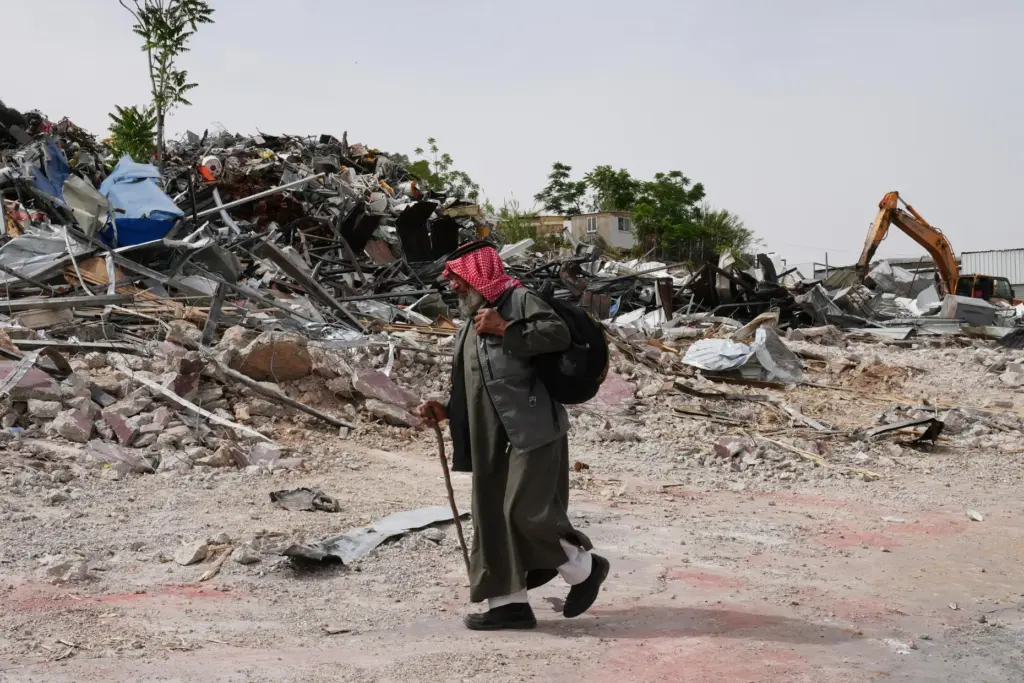 A man inspects the site of an Israeli army demolition campaign