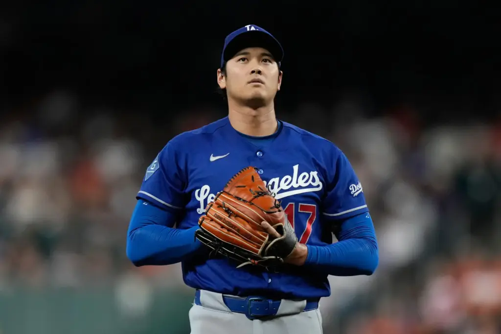 Dodgers starting pitcher Shohei Ohtani stands on the mound during...