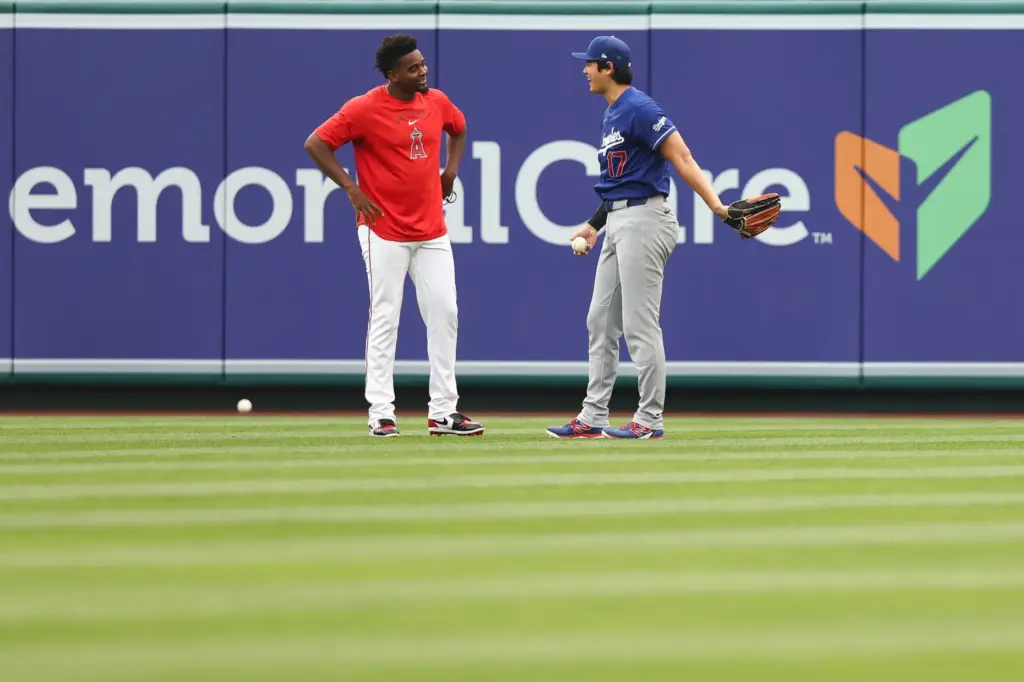 Dodgers’ Shohei Ohtani, right, and Angels’ JosÃ© Soriano, left, interact...