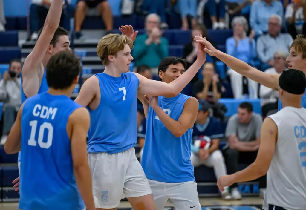 Corona del Mar players celebrate after defeating Mater Dei in...