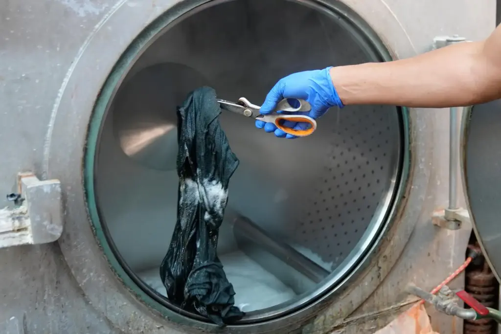 A piece of clothing is examined for color during a...