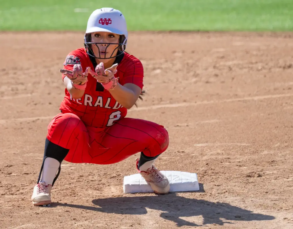 Whittier Christian third baseman Sofia Hernandez gives Spiderman pose to...