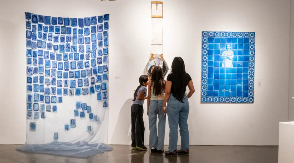 Visitors view art at the âMade in Californiaâ exhibit at...
