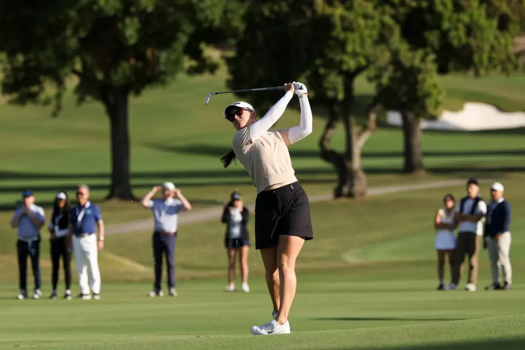 Hannah Green hits from the fairway on the eighteenth green...