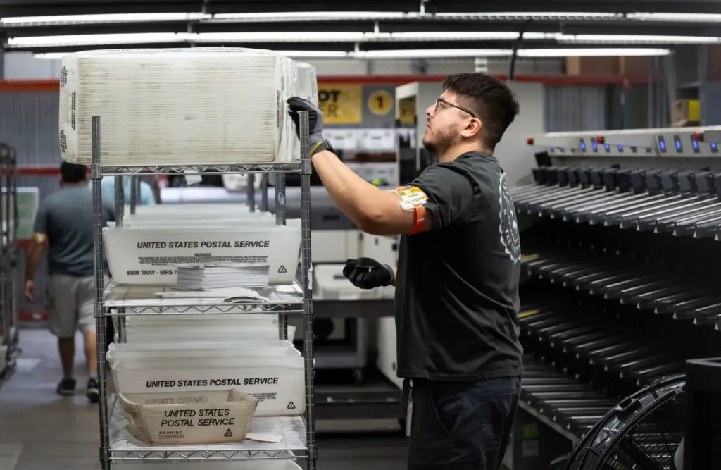 People work in sorting and extracting at the Orange County...