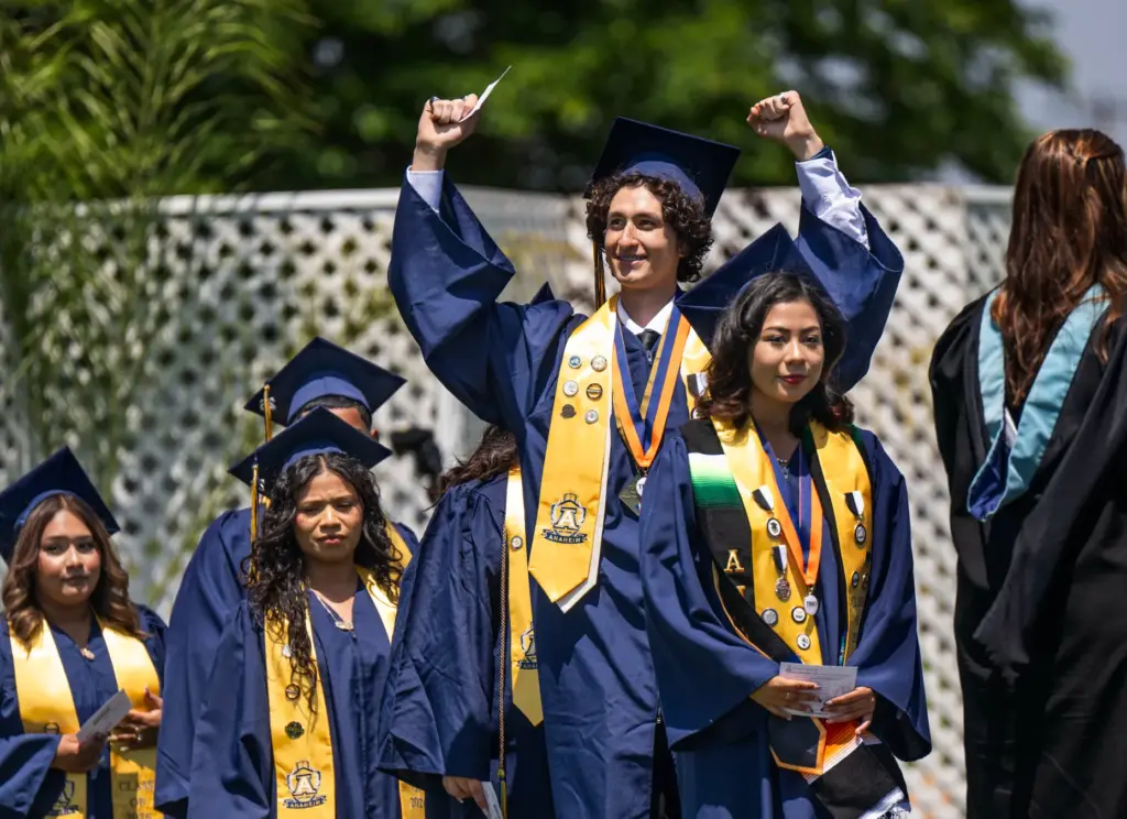 Graduates line up to receive their diplomas during the Anaheim...