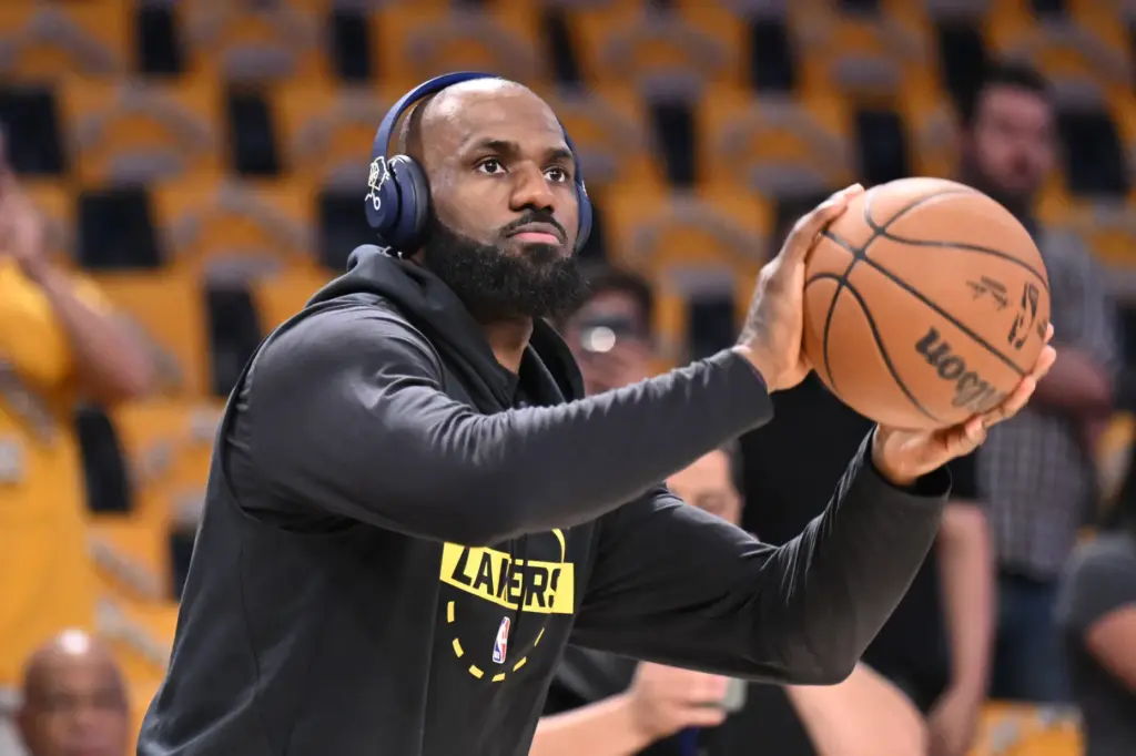 Lakers star LeBron James warms up before Game 4 of...