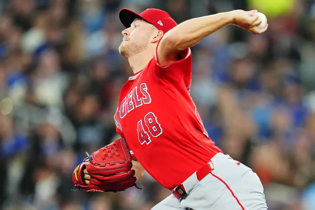 Angels starting pitcher Reid Detmers throws to the plate during...