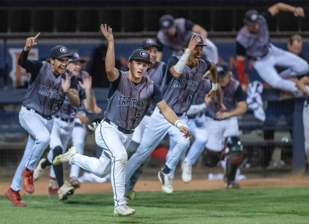 Glendora players celebrate as they beat Laguna Beach 3-2 in...