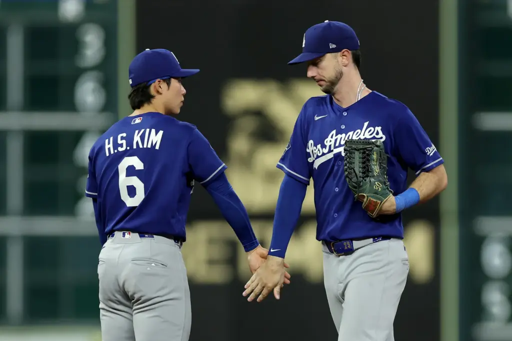 Dodgers shortstop Hyeseong Kim, left, and right fielder Kyle Tucker...