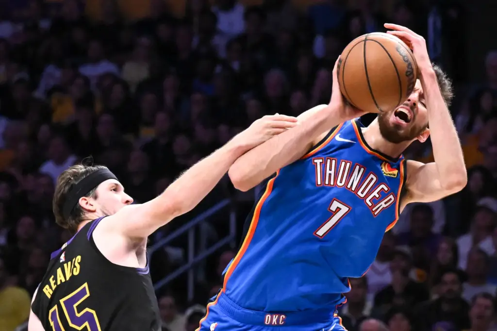 Oklahoma City Thunder forward Chet Holmgren grabs a rebound in...