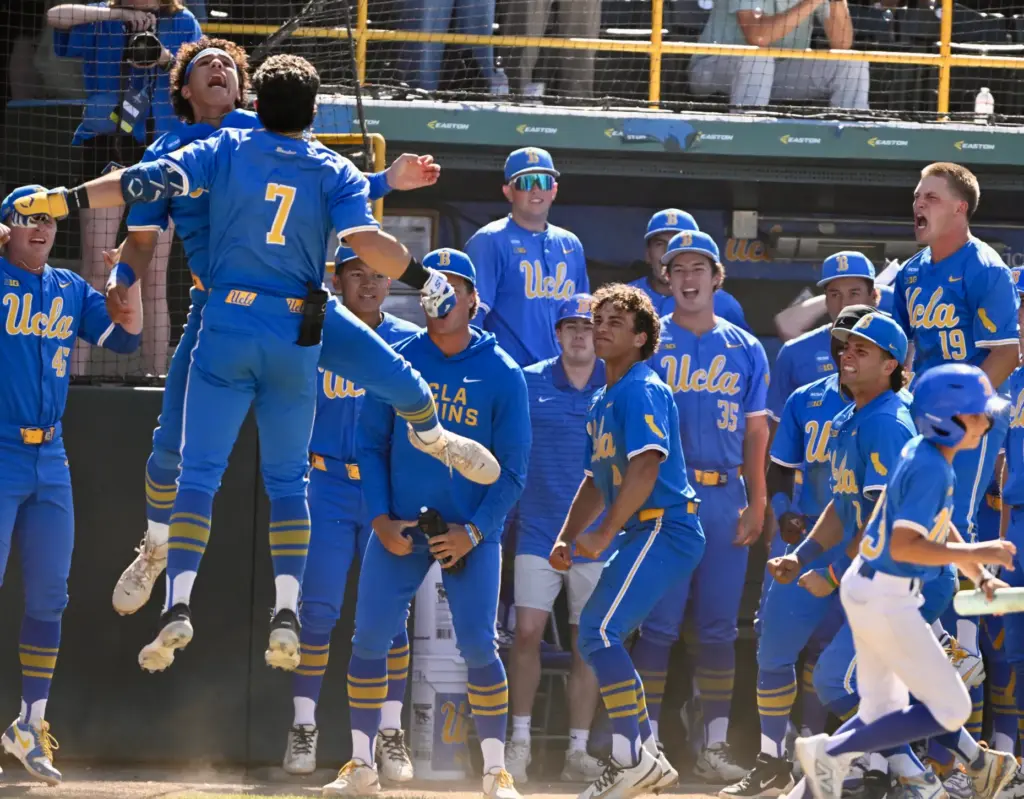 Roman Martin #7 of the UCLA Bruins celebrates with teammates...