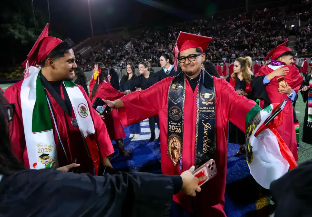 Jose Sotelo goes to hug one of his teachers after...