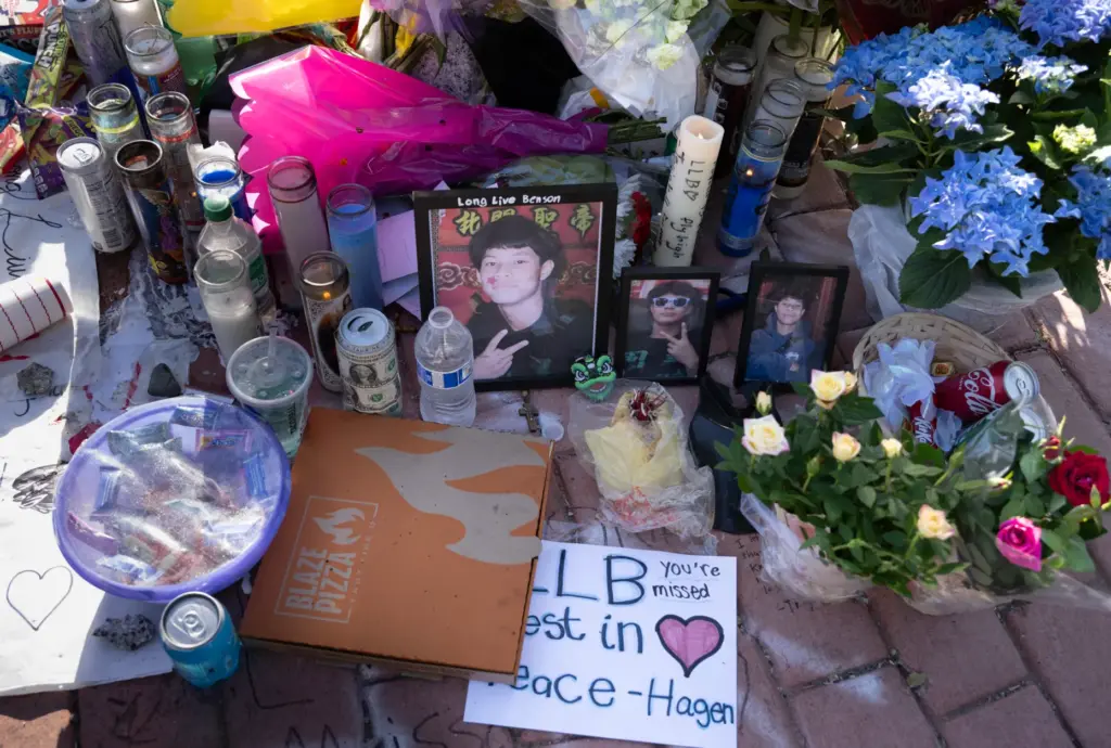 Messages, photos, flowers and food are left at the crash...