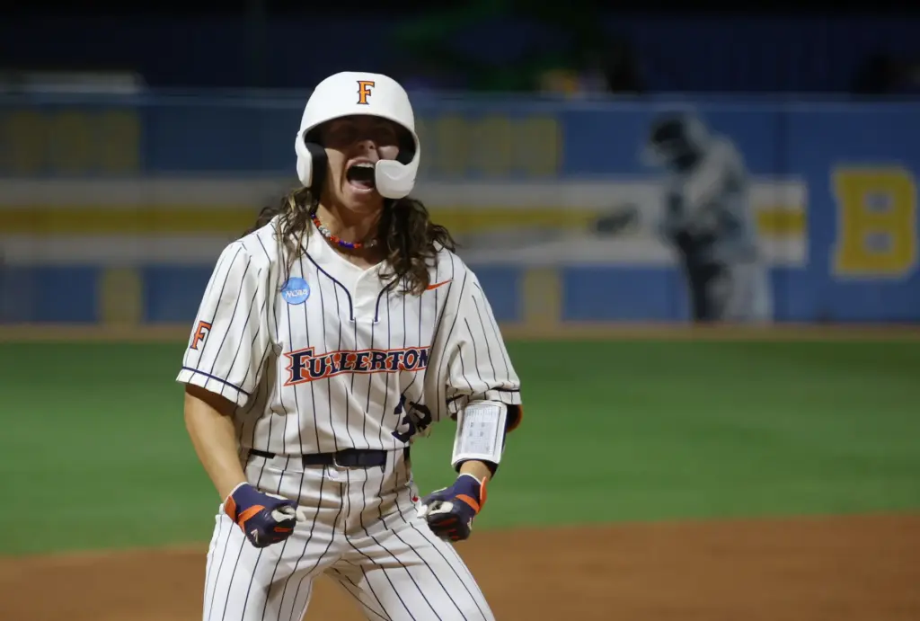 Cal State Fullertonâs Maggie Paulovich celebrates after driving in a...