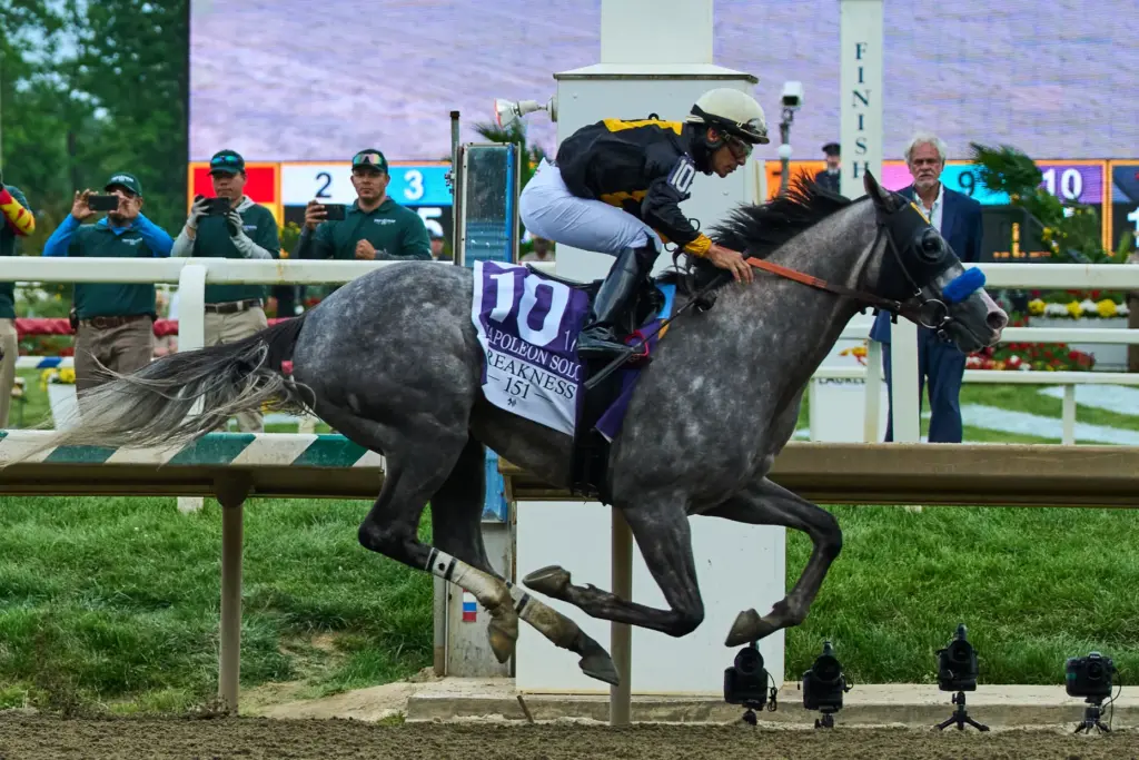 Paco Lopez, atop Napoleon Solo, wins the 151st running of...