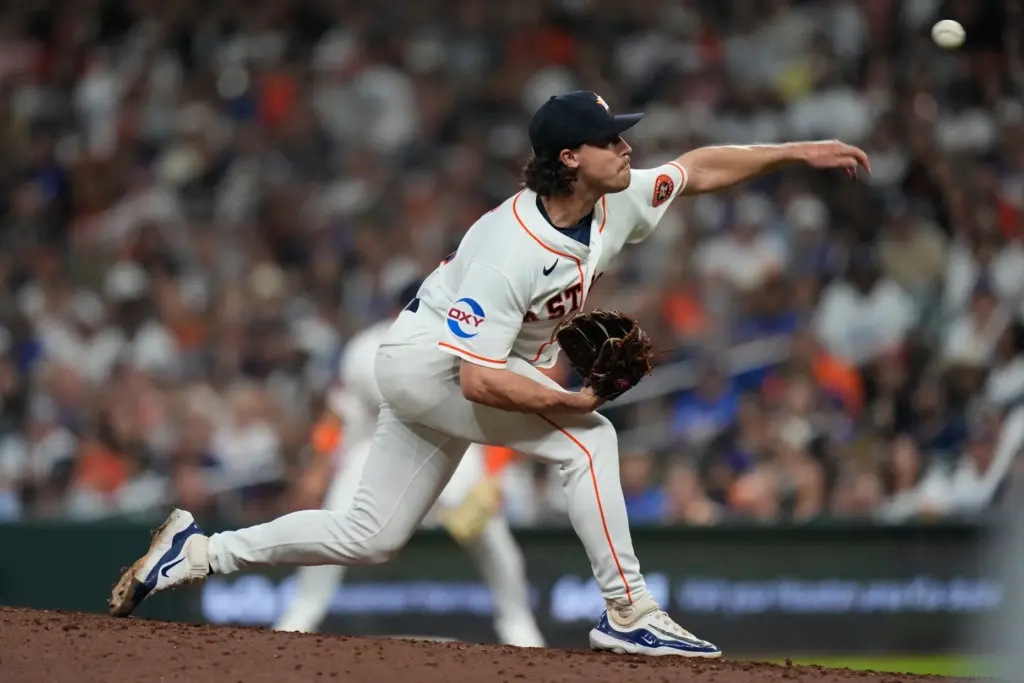 Houston Astros relief pitcher Bryan King throws to the plate...