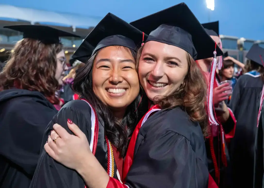 Friends Sophia Arendt, left, and Natalie Jakoda celebrate together at...