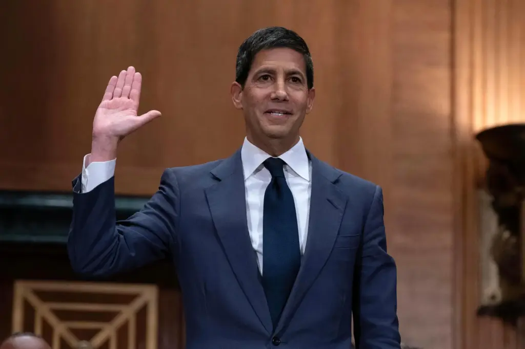 Kevin Warsh is sworn in during his nomination hearing to...