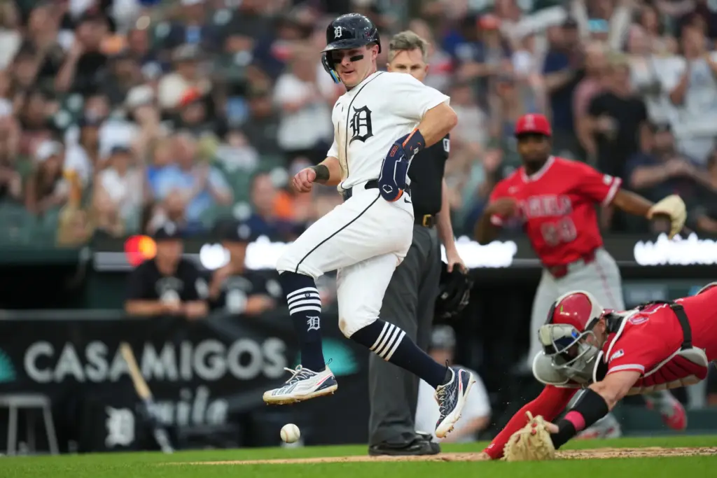 The Detroit Tigers’ Kevin McGonigle, left, avoids the ball while...