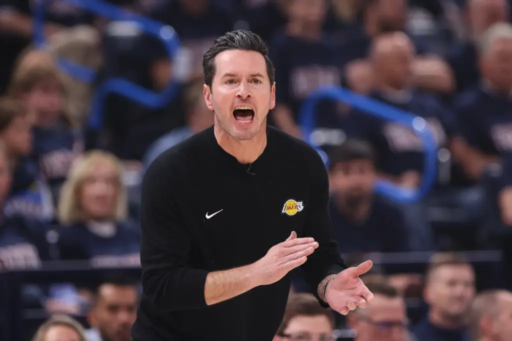 Los Angeles Lakers head coach JJ Redick reacts to play...