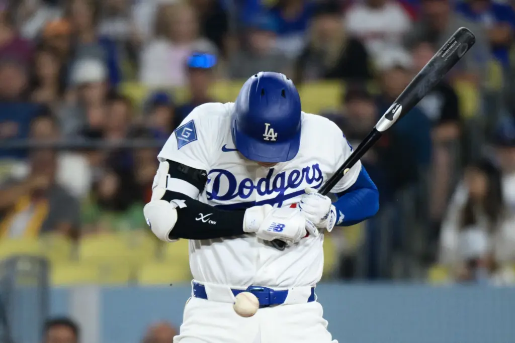 Dodgers star Shohei Ohtani backs off from an inside pitch...
