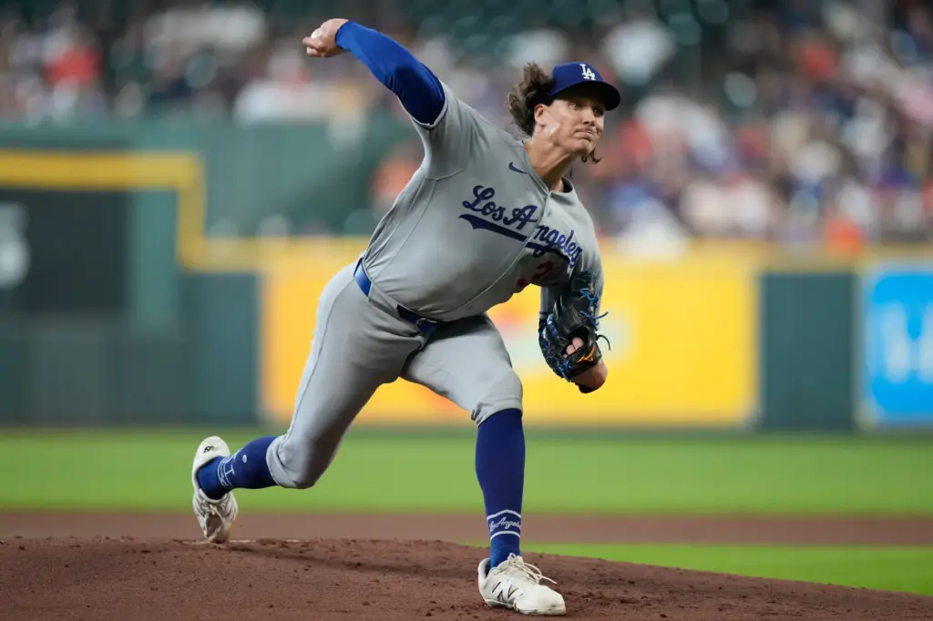 Dodgers starting pitcher Tyler Glasnow throws to the plate during...